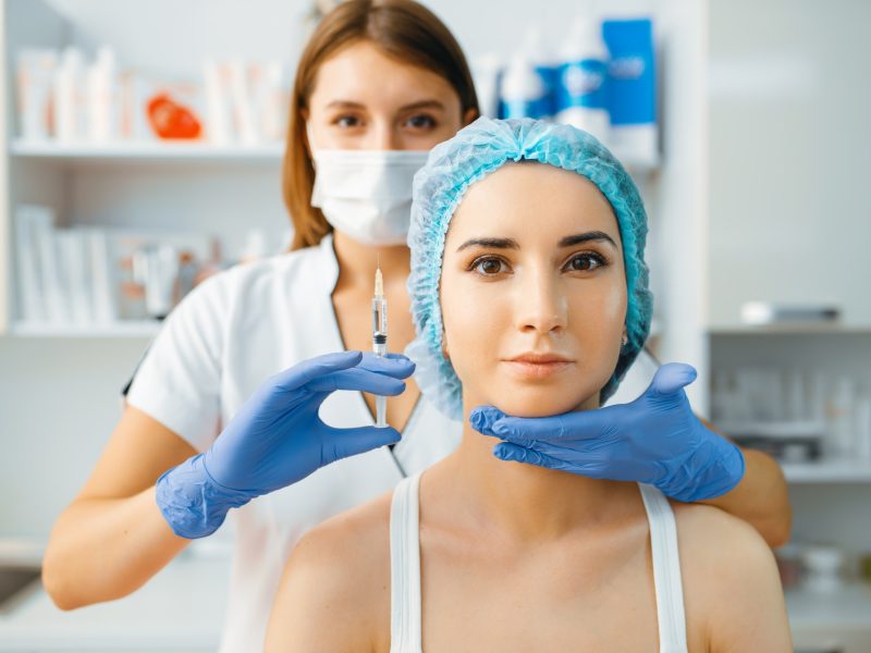 cosmetician-holds-syringe-with-injection-of-botox.jpg